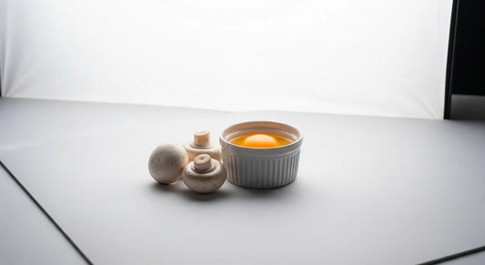 Tea cup with a light-colored interior on a white surface