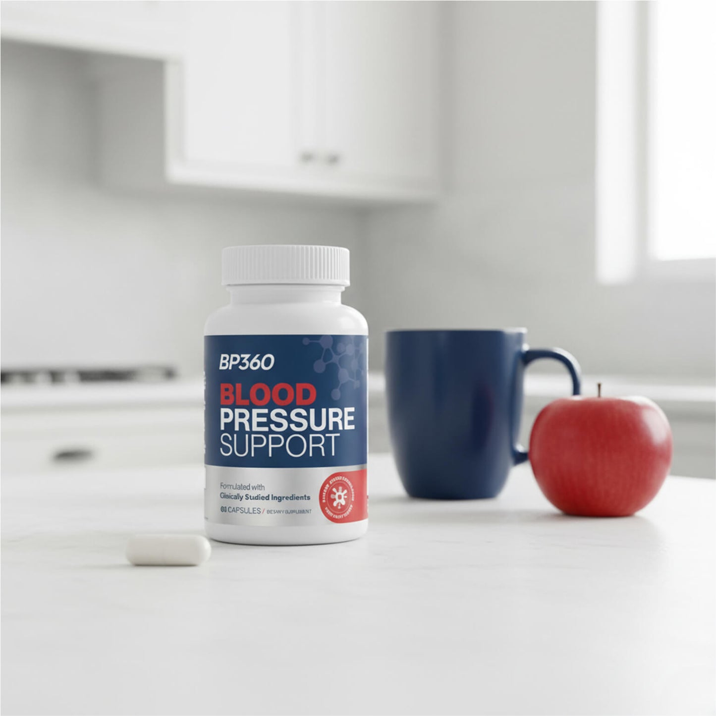 BP360 Blood Pressure Support supplement bottle on a kitchen counter with an apple and mug.